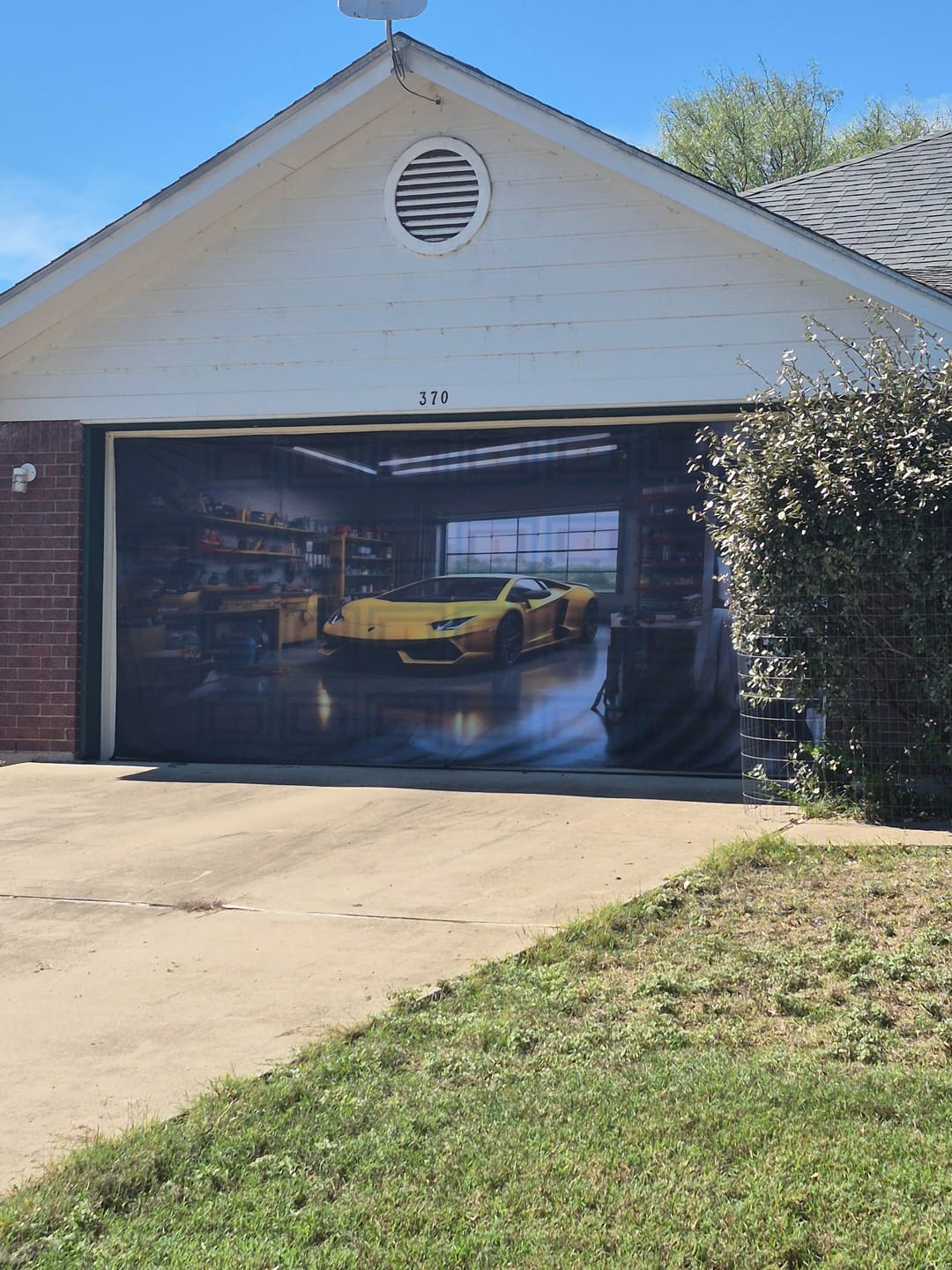 Customer photo review of CLEARANCE — Yellow Lamborghini Huracan Parked in the Garage - Garage Door Cover Banner Wrap #2