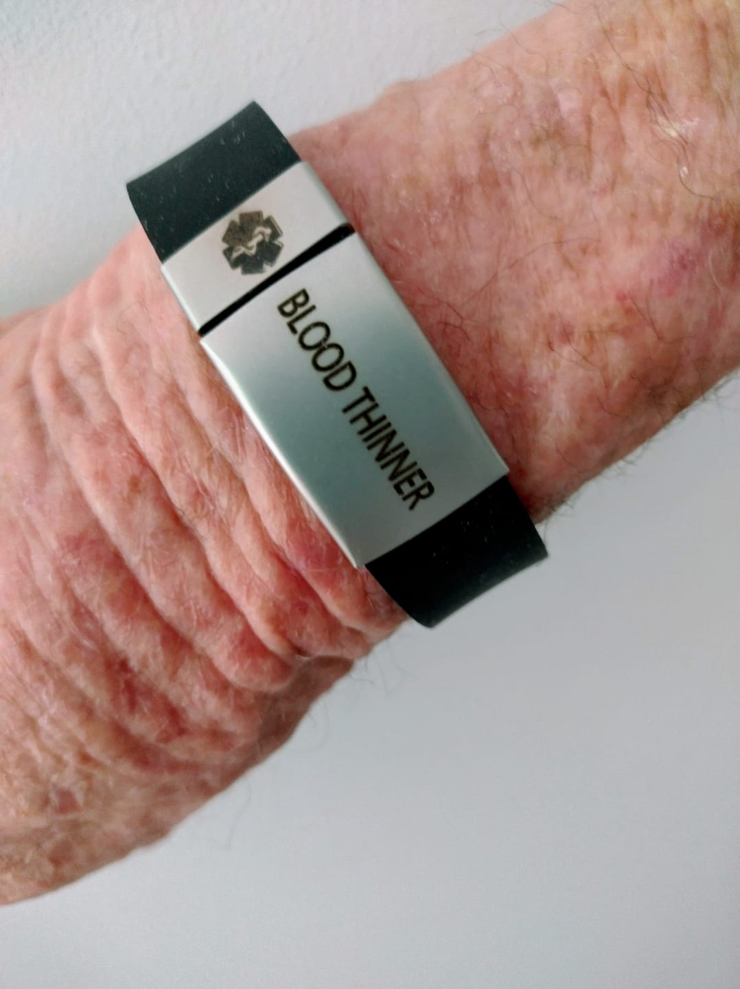Customer photo review of Personalised Black Silicone Medical Alert ID Bracelet – Silver Bar