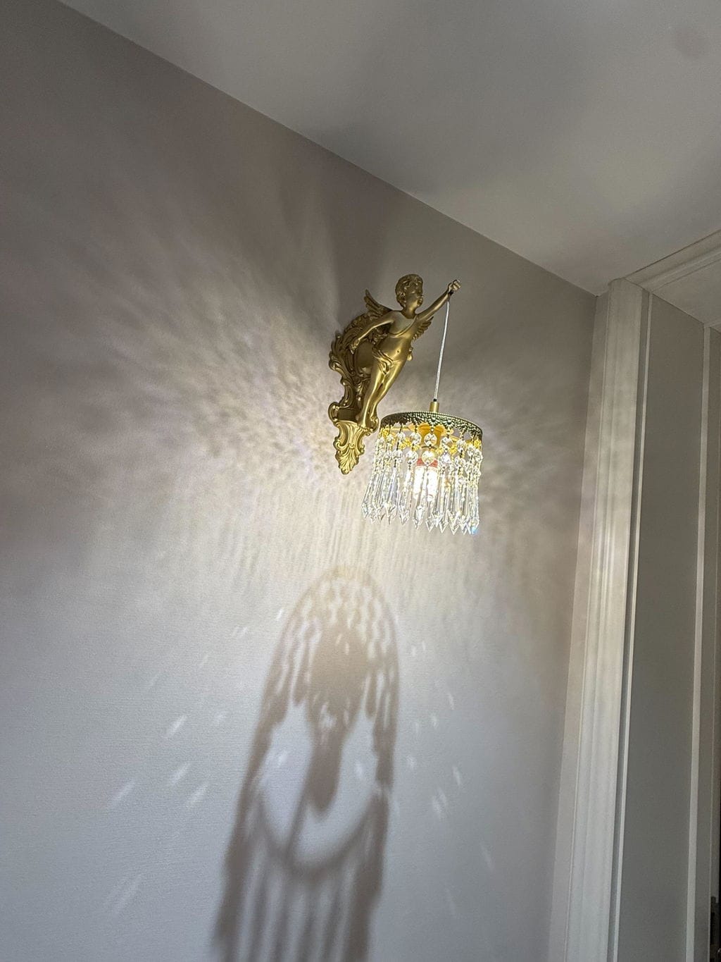 Customer photo review of Baroque Cherub Wall Light, Copper Finish, Clear Glass, Wall Sconce