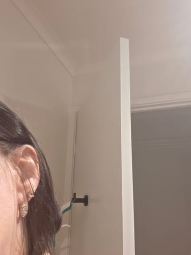 Customer's Krystal Couture Huggie Earrings featuring sparkly crystal embellishment worn on their earlobe.