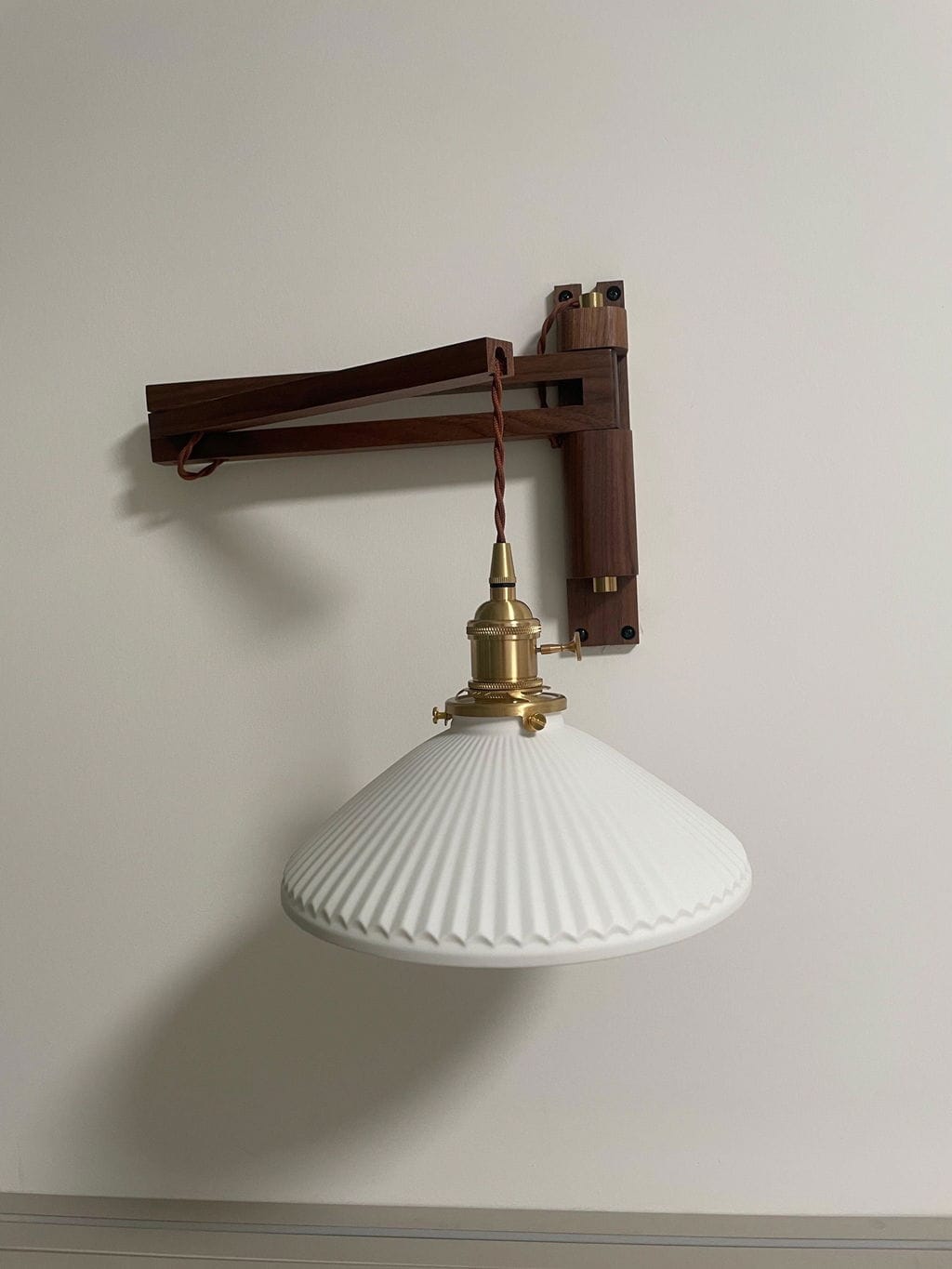 Customer photo review of Swing Arm Wall Light, Wood and Brass, Plug In Wall Sconce