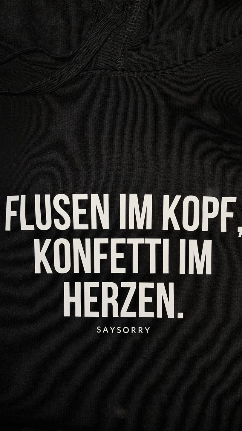 Customer photo review of 100% Organic unisex Hoodie in vielen Farben »Flusen im Kopf, Konfetti im Herzen.«