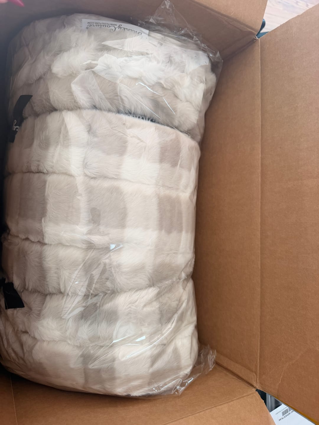 Customer photo review of Original Hugs Sophia Cream Gingham Blanket