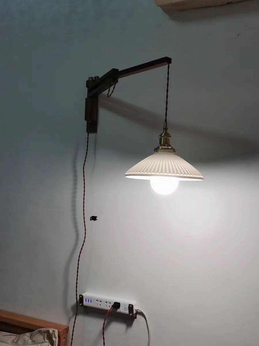 Customer photo review of Swing Arm Wall Light, Wood and Brass, Plug In Wall Sconce