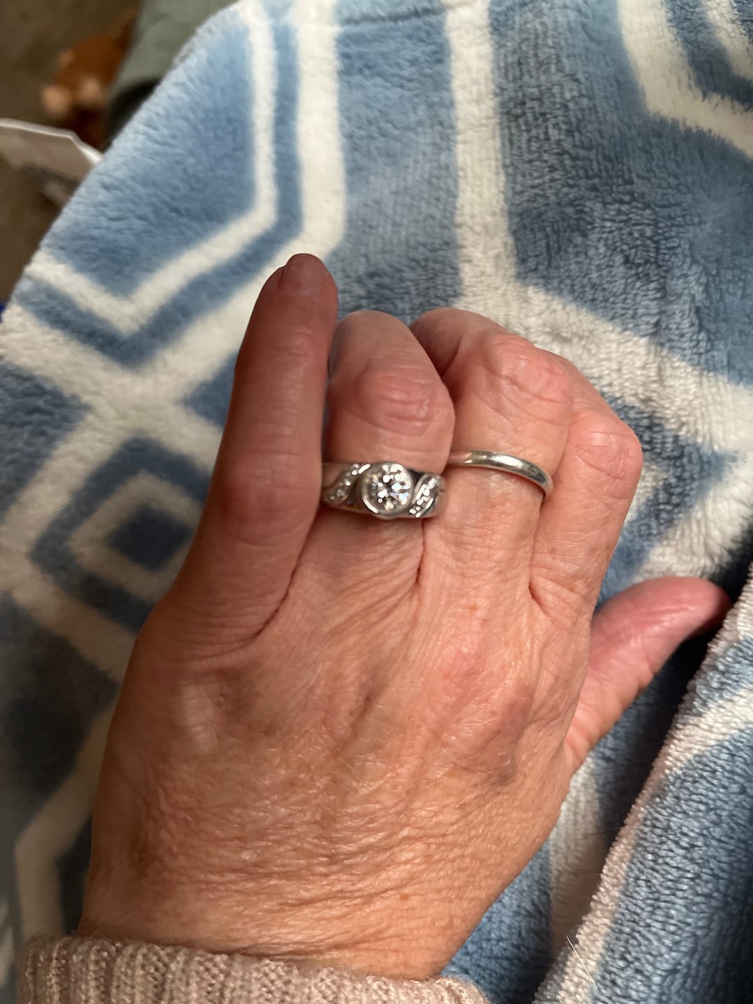 Customer photo review of Endless Flow Round Bezel Set Moissanite Wide Band Engagement Ring