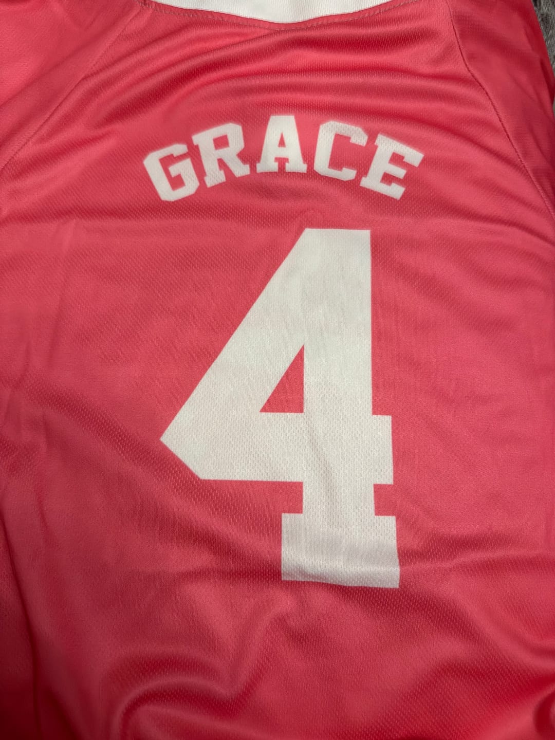 Customer photo review of Custom Two Button Softball Jersey Pink and White – Design Your Own
