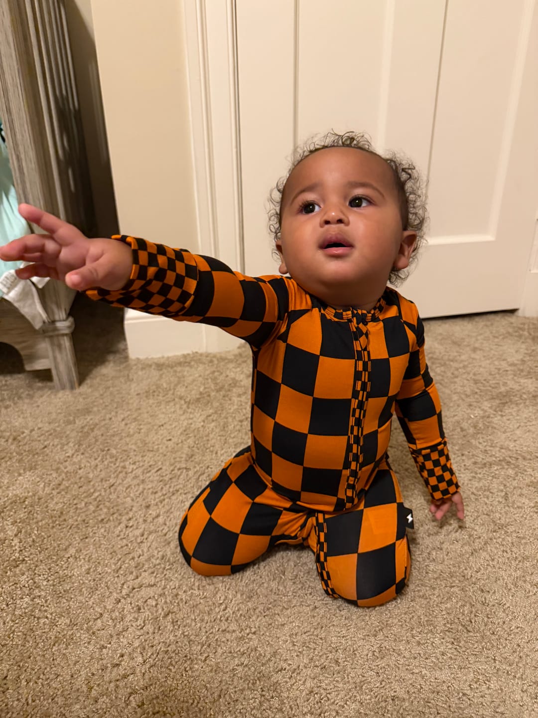 Customer photo review of Bamboo Zippy Sleeper in Jack-O Lantern Checkered