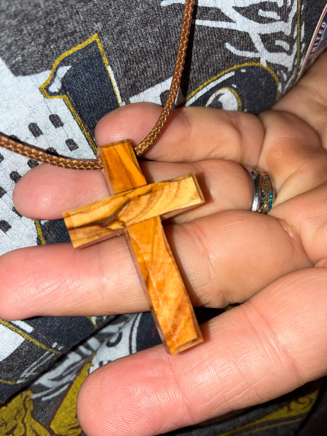 Customer photo review of Holy Land Plain Olive Wood Cross Pendant