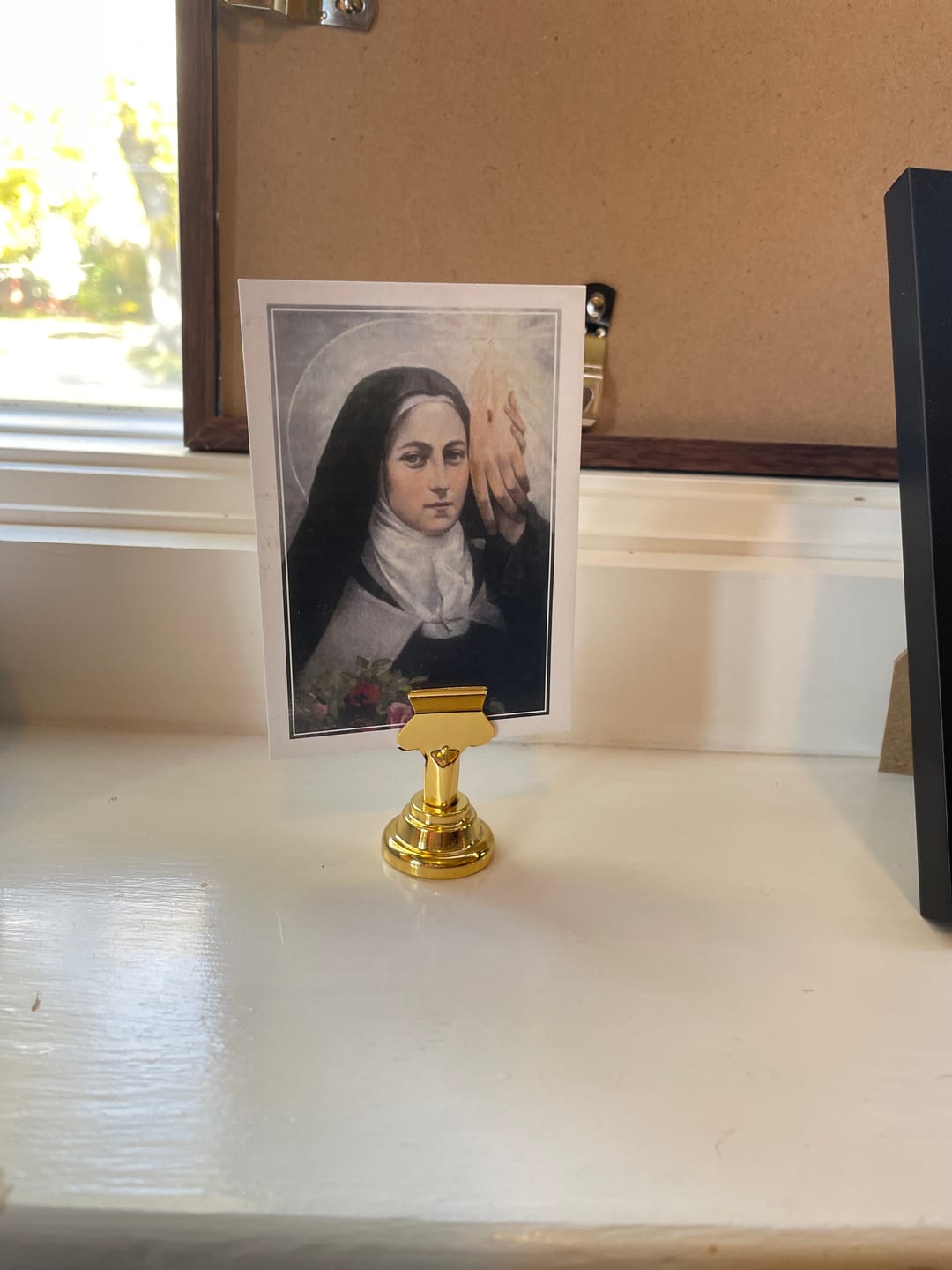 Customer photo review of Holy Card Stand – Stand Only – (Holy Card Not Included) – Brass-Colored Steel Stand to Display Holy Card