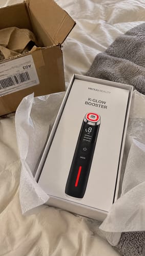 Photo d’une cliente avec le K‑Glow Booster