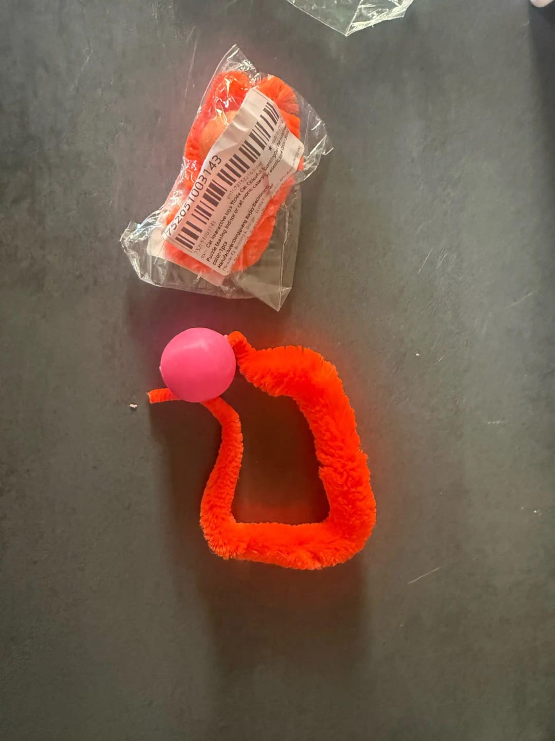 Customer photo review of Bouncy Cat Toy Balls with Fuzzy Worm Tails