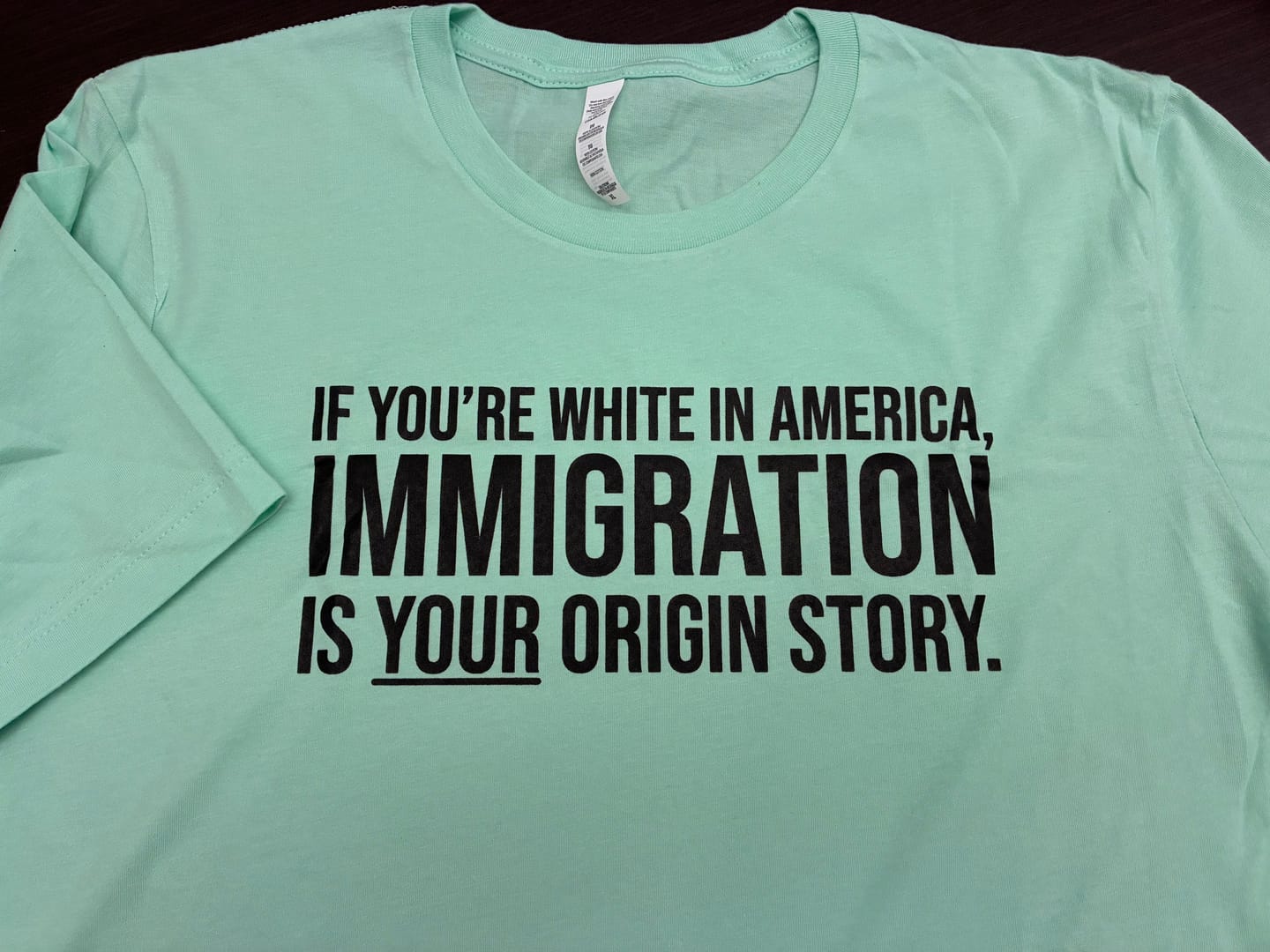 Customer photo review of If you're white in America, IMMIGRATION is your origin story Unisex Tee