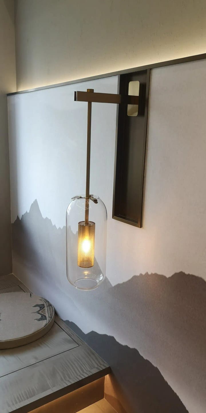 Customer photo review of Gold Tone Glass Wall Light with Hanging Cylinder Shade
