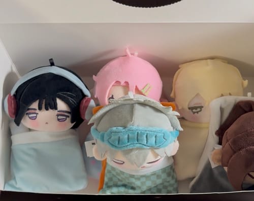 Customer's Alien Stage Dreaming Hours plush pendants displayed together in their open blind box.