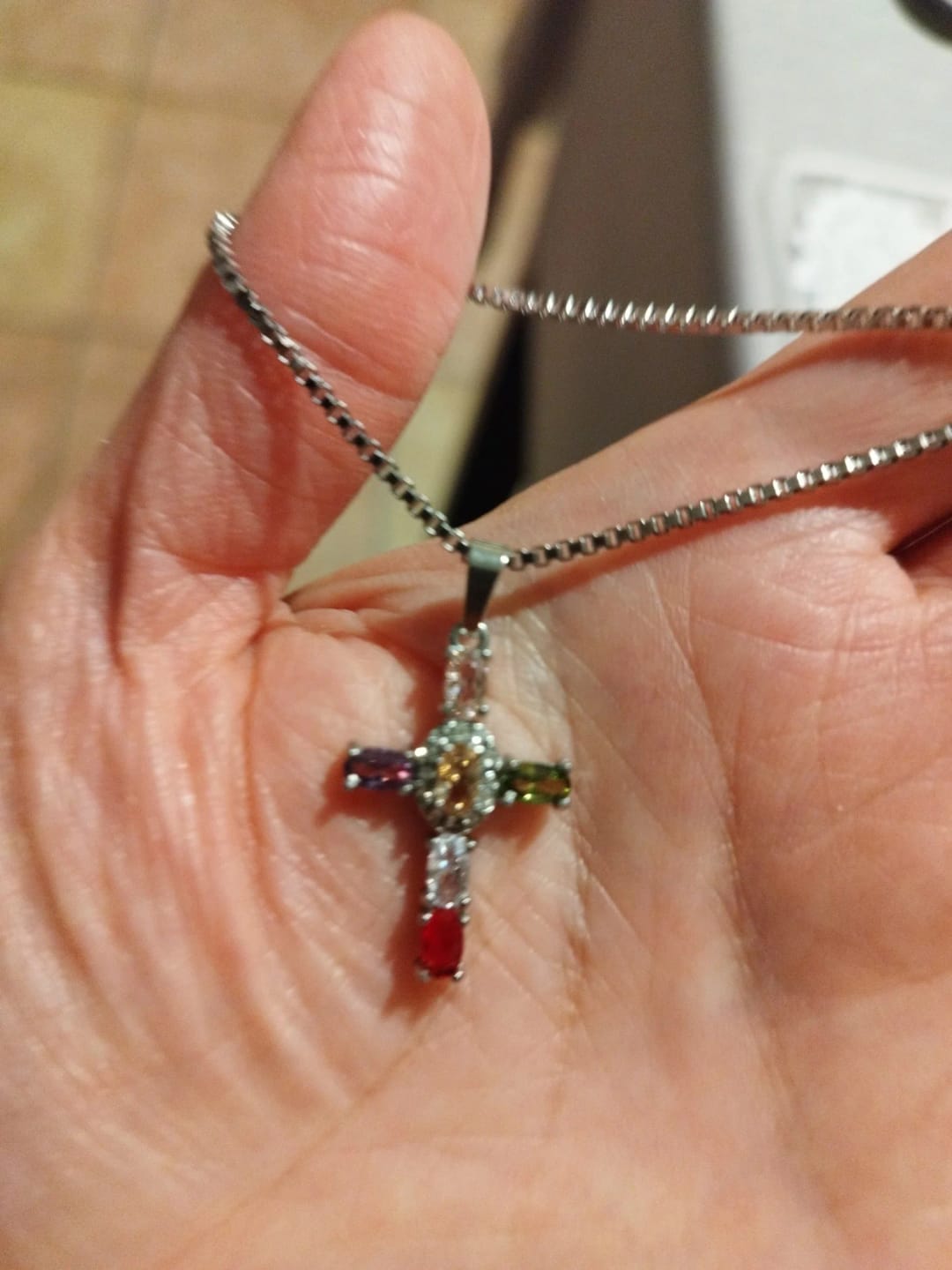 Customer photo review of Halo Glow Cross Necklace