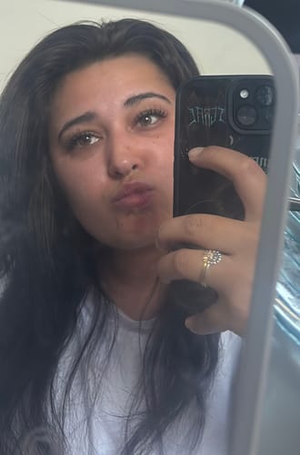 Customer's mirror selfie wearing THE MANGA EYE lashes, which look spiky and lifted.