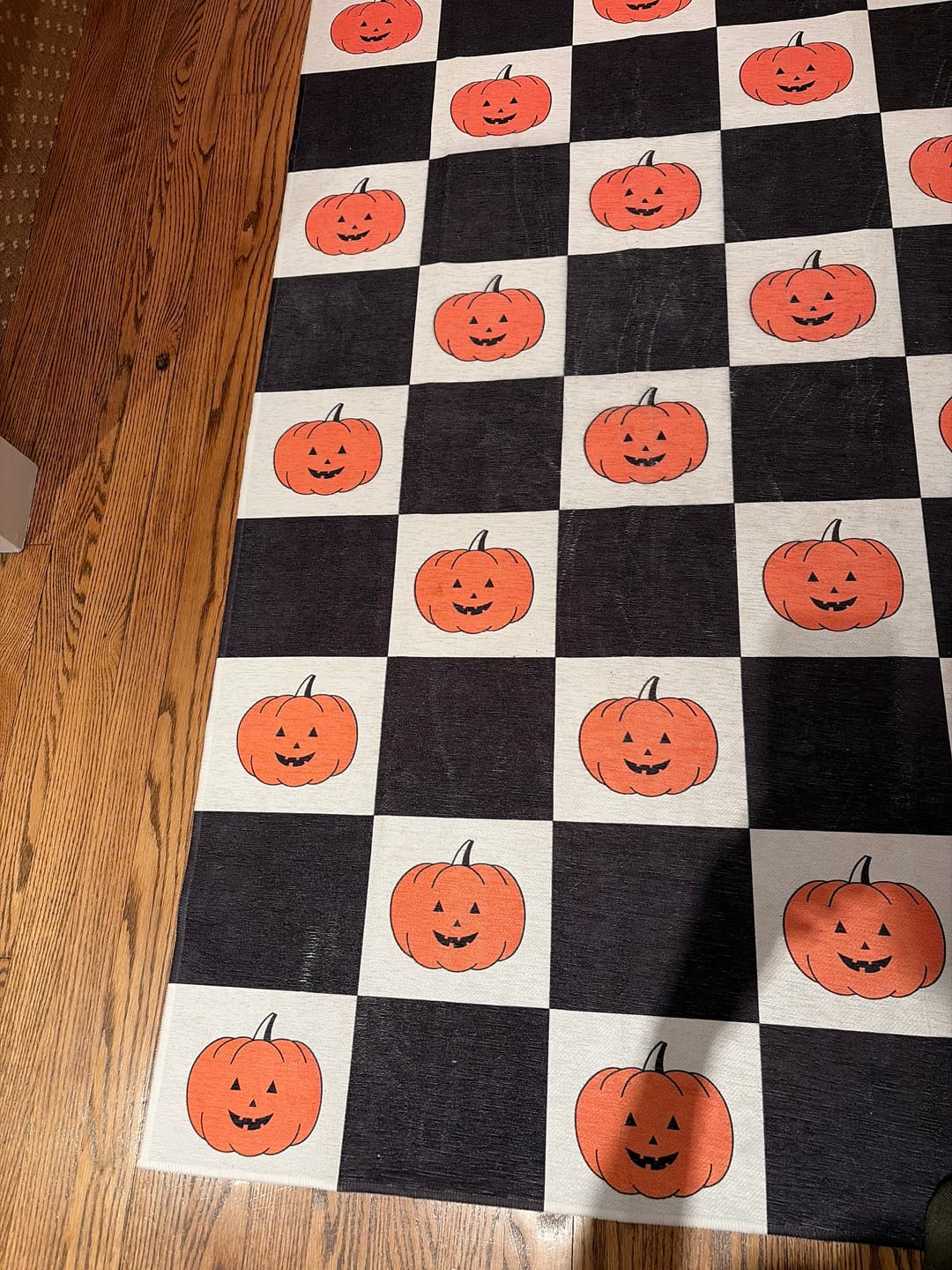 Customer photo review of Checkered Pumpkins Halloween Machine Washable Rug