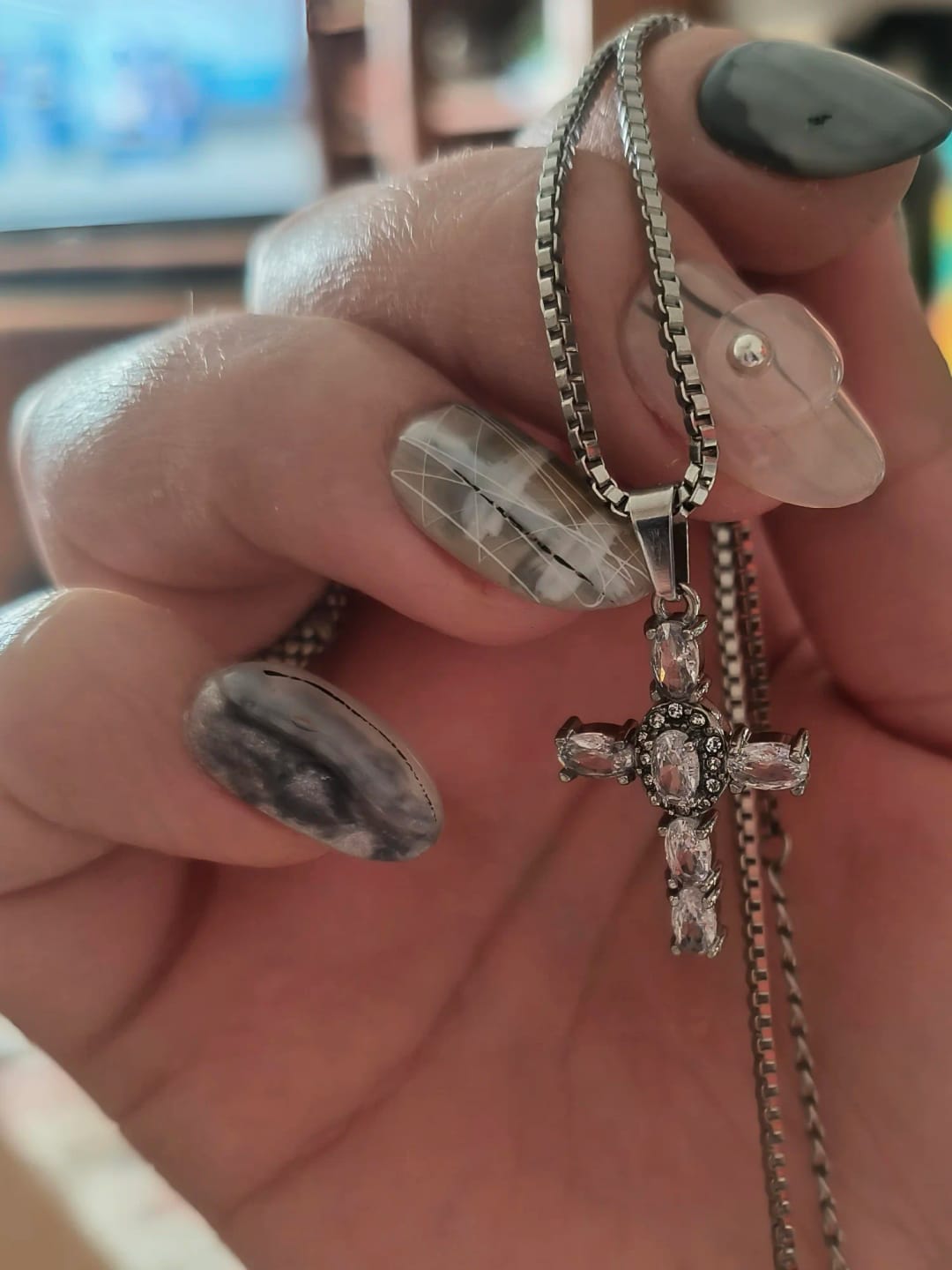Customer photo review of Halo Glow Cross Necklace