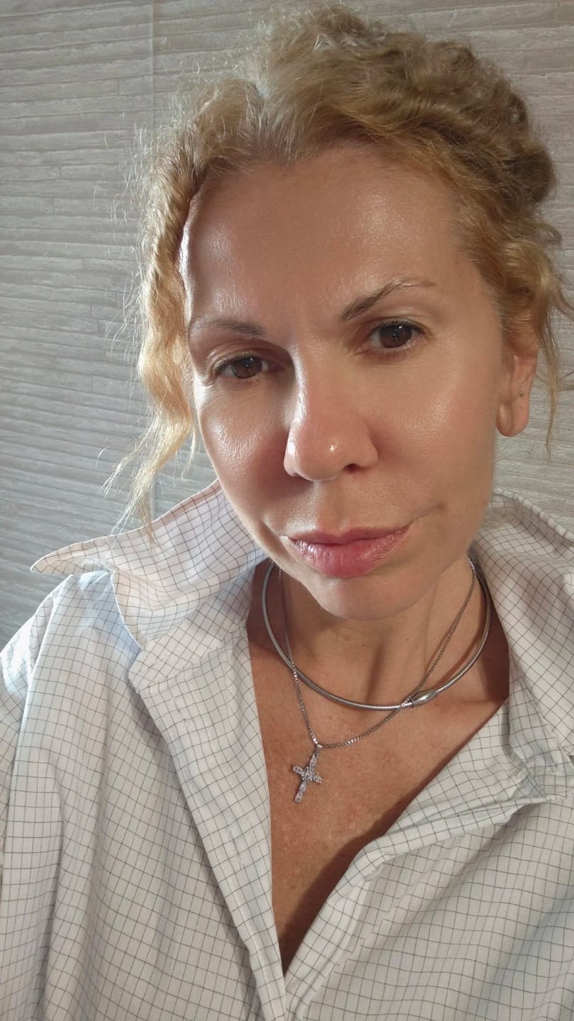 Customer photo review of Halo Glow Cross Necklace