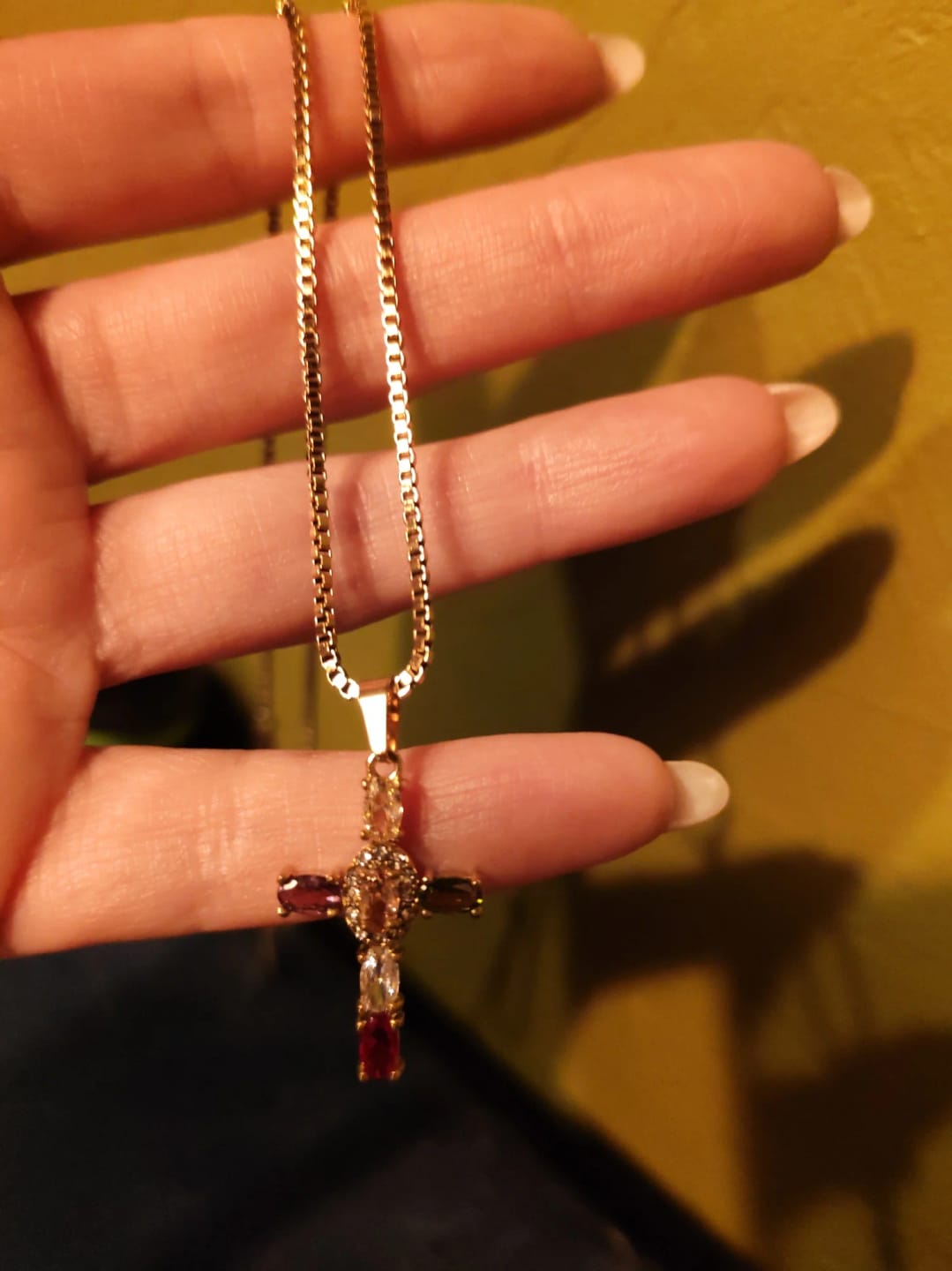 Customer photo review of Halo Glow Cross Necklace
