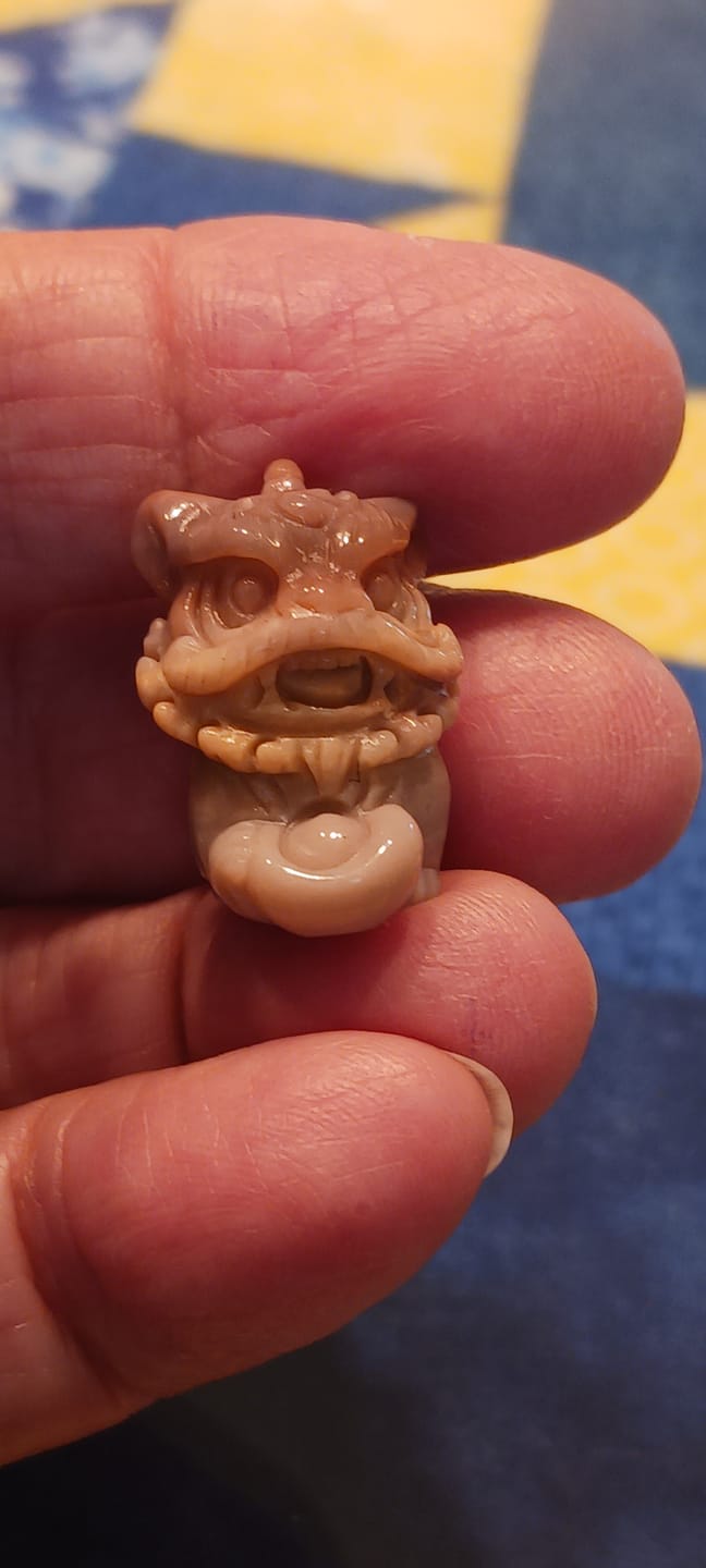 Customer photo review of Natural Crystal Alashan Agate Lion Dance Mini Carving