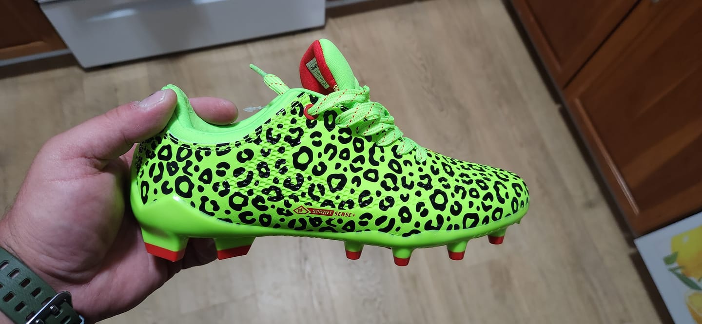 Customer photo review of Phenom Elite Quantum Carbon Football Cleats – Slime Leopard
