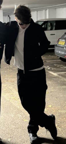 Customer's Wyatt Black Twill Pants, worn by a person in a casual standing pose outdoors.
