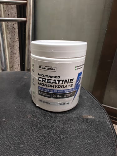 Customer's Wellcore Micronised Creatine Monohydrate container resting on a black seat.