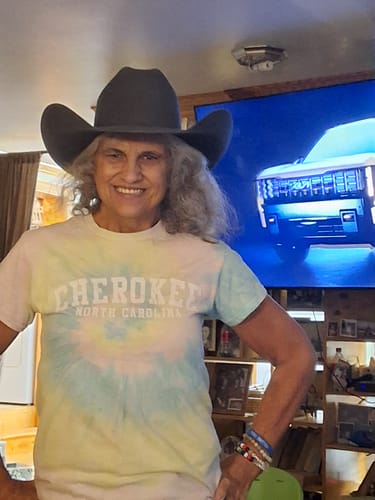 Customer's gray western hat being worn while smiling