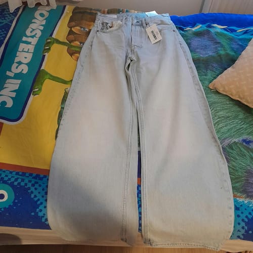 Customer's Açık Mavi Barrel Fit Baggy Jean Pantolon laid flat on a bed.