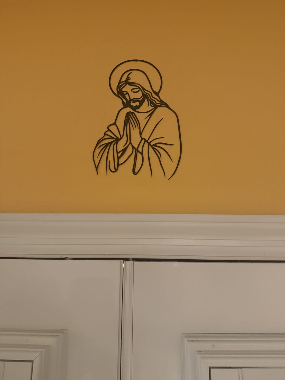 Customer photo review of Christianartworkshop Minimal Line Art Praying Jesus Halo Metal Wall Decor: A Symbol of Humble Sacred Devotion