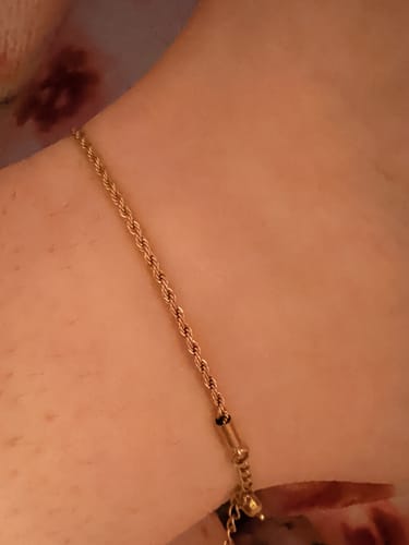 Customer's gold Calla Gold Twisted Chain Anklet worn on ankle