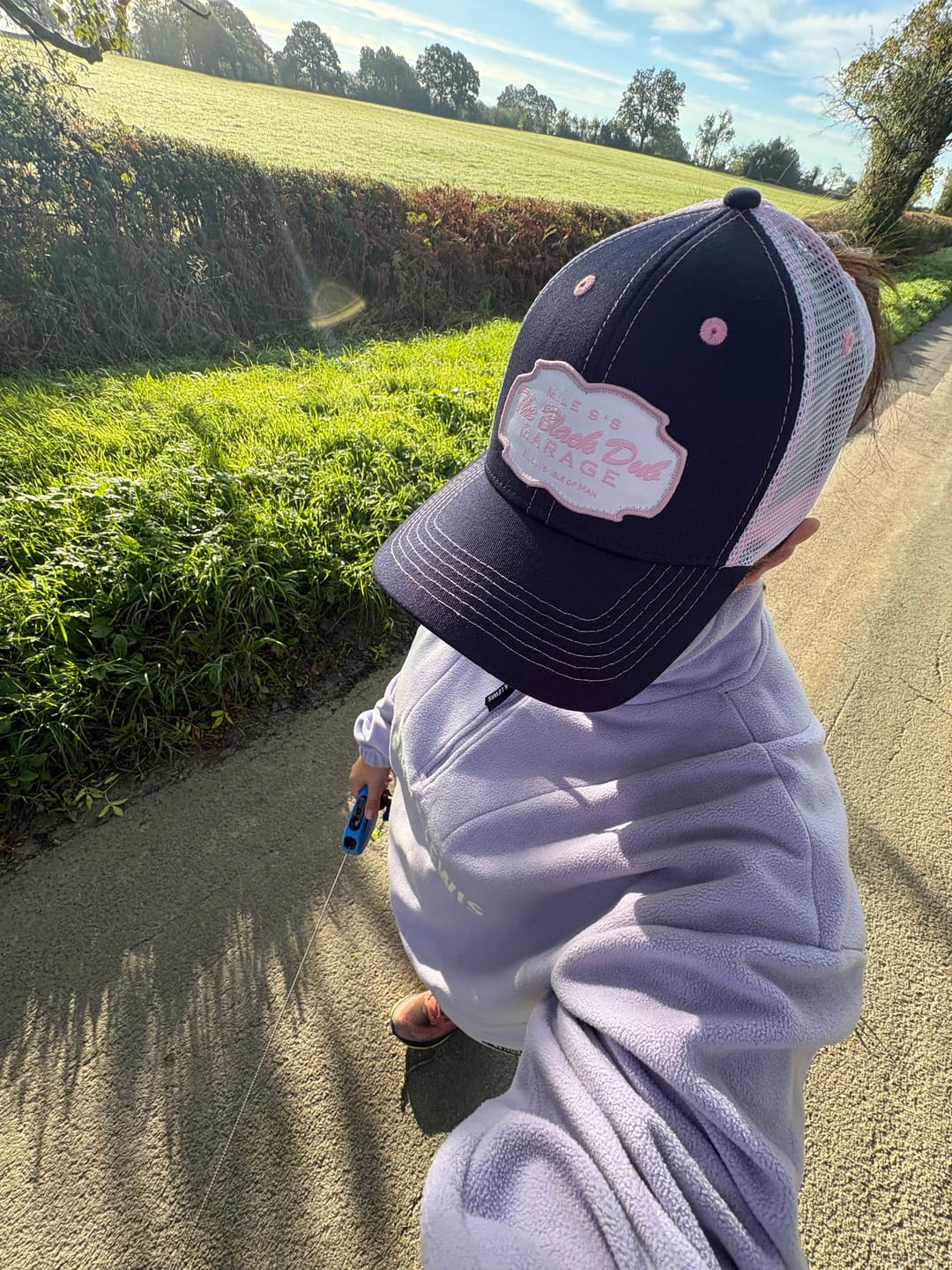 Customer photo review of Pink & Navy Garage Trucker Hat