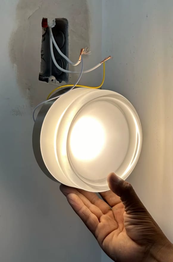 Customer photo review of Round Amber Glass Wall Sconce with Warm Light