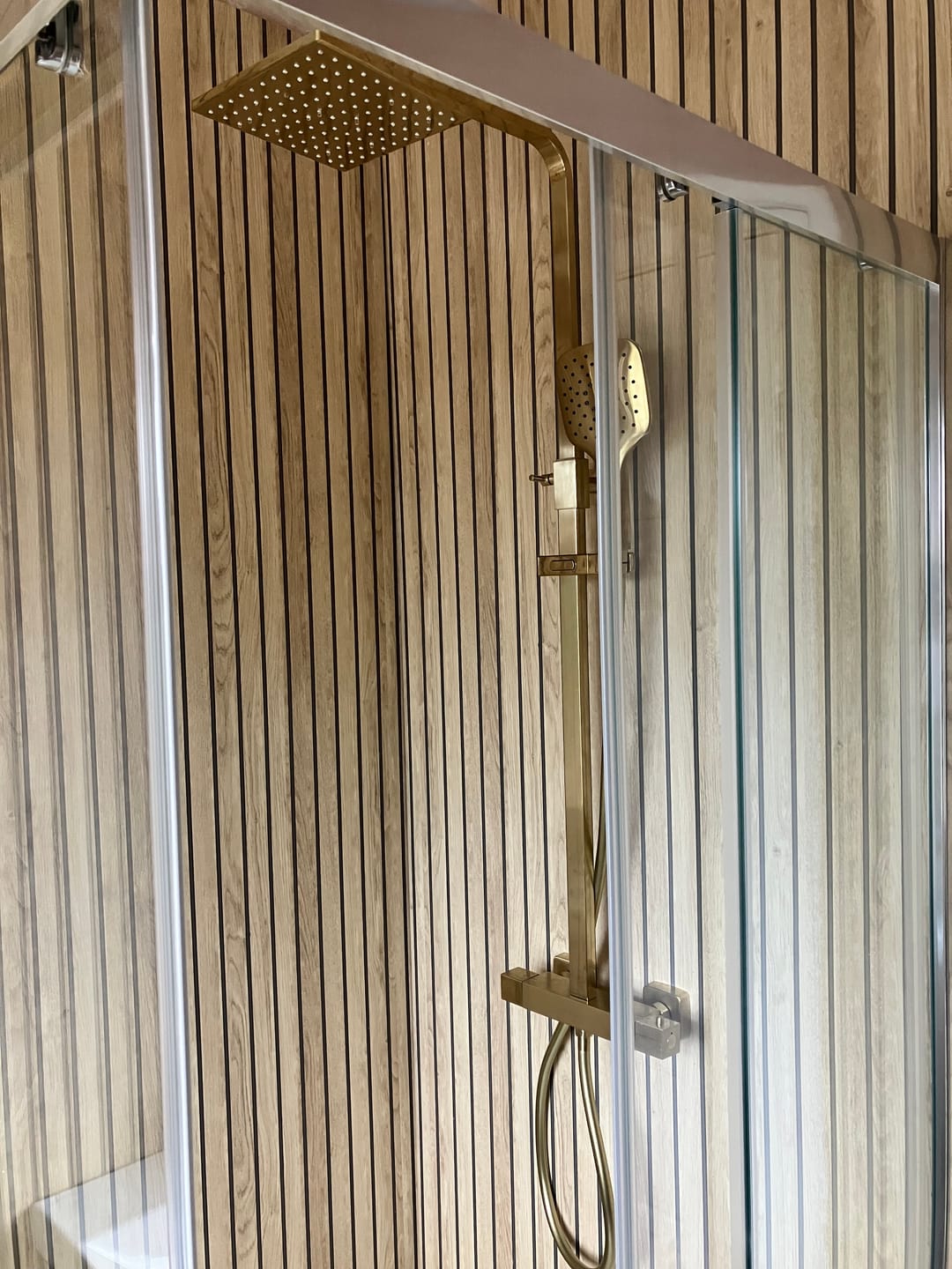 Customer photo review of Sivara Oak Slatted Wood Effect PVC Waterproof Shower Panel