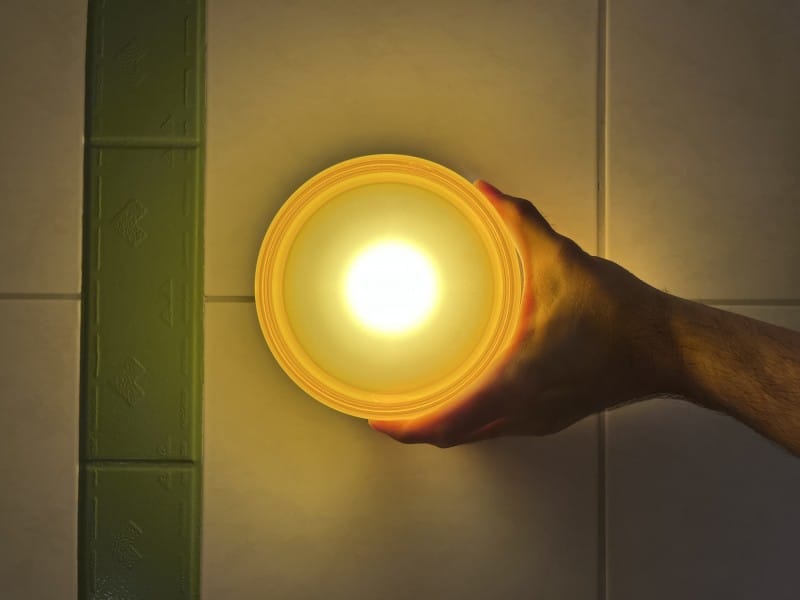 Customer photo review of Round Amber Glass Wall Sconce with Warm Light