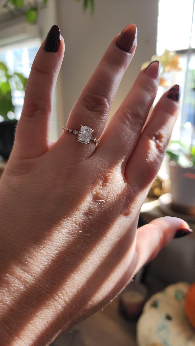 Customer photo review of Joyee 2.5 Carat Elongated Cushion Cut Hidden Halo Lab Grown Diamond Ring in 14k Yellow Gold