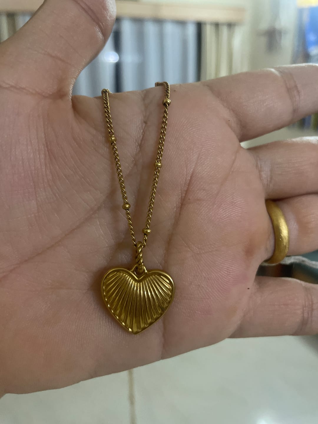 Customer photo review of Heart Rays Necklace