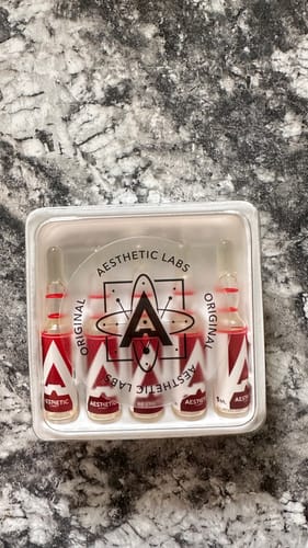 Customer's Aesthetic NPPX 100 vials in a protective white tray, showcasing the original packaging and branding.