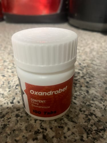 Customer's Betha Pharma Oxandrobet bottle with red label on a countertop.