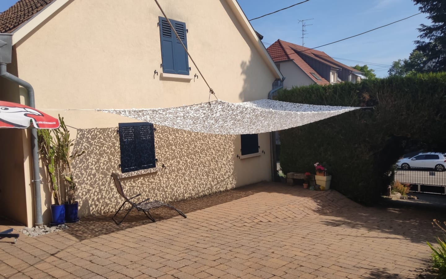 Customer photo review of Voile d'ombrage camouflage blanc