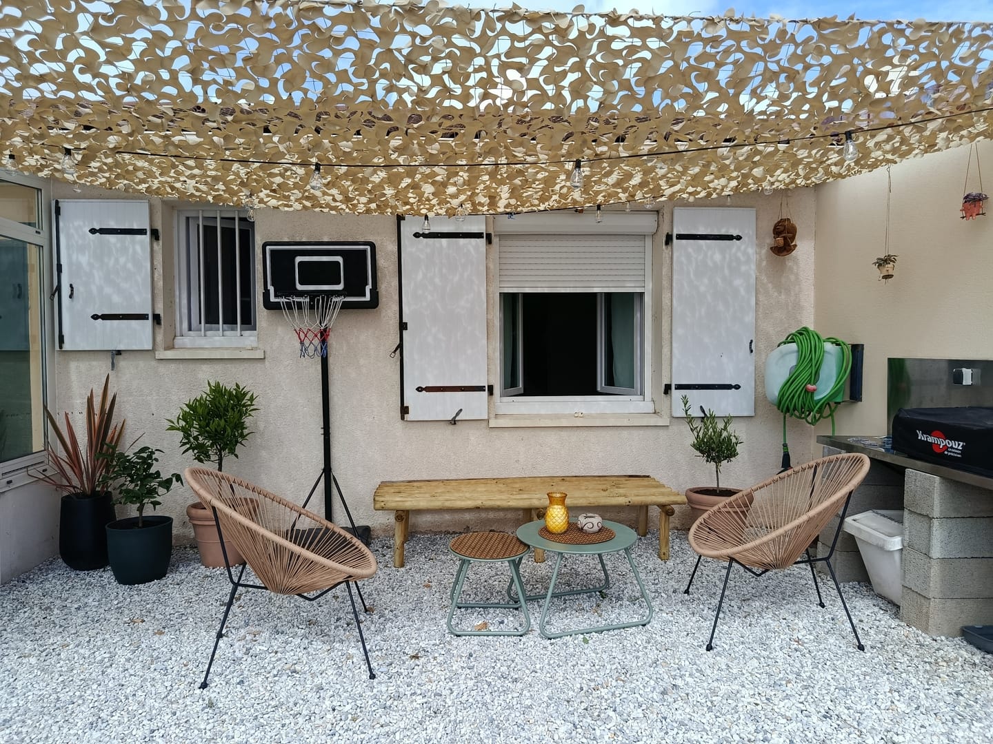 Photo de Laetitia L. : Voile d'ombrage camouflage renforcée à câble acier