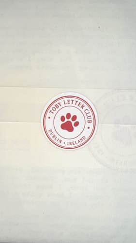 Customer's Toby's Letter Club envelope sealed with a red paw print sticker logo from Dublin, Ireland.