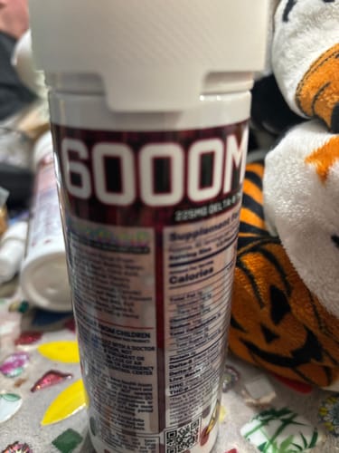 Reviewer's close-up shot of the back nutritional label and ingredients on a bottle of gummy vitamins.