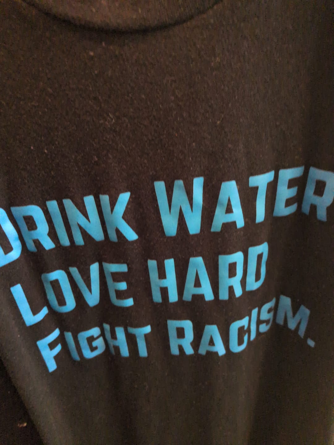 Customer photo review of Drink Water Fight Racism Unisex T-shirt