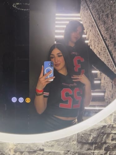 Customer photo review of Custom Black Mesh Authentic Football Jersey with Purple and Teal Lettering