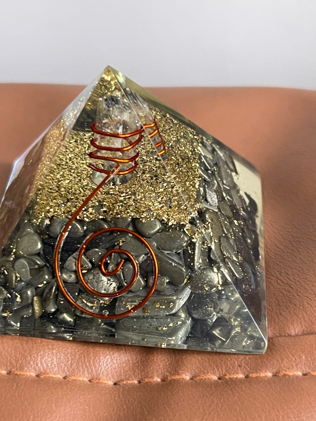 Customer photo review of Pyrite Copper Coil Orgone Pyramid Vastu Remedy for Wealth Magnetism, Money Protection and Prosperity Support for Home, Office and Business Spaces | 6.5 cm | 150 g