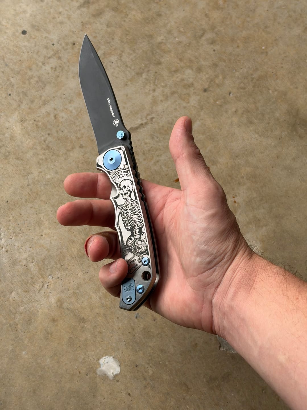 Customer photo review of Spartan Blades Harsey Folder SHF - Memento Mori Special Edition, Engraved Skeleton, Black PVD MagnaCut, Blue Hardware - Made in USA (SF5MMORI)
