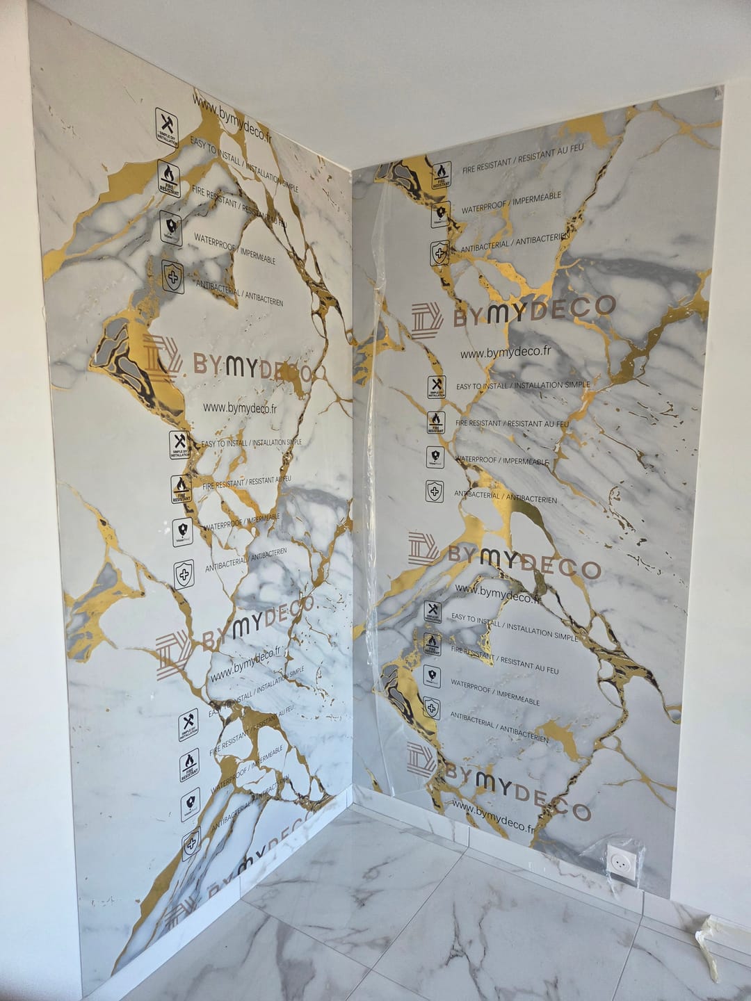 Customer photo review of Panneau Mural PVC Marbre Qatar – Veiné doré, Facile a Poser