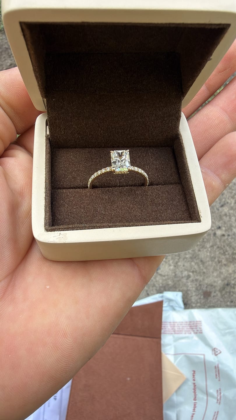 Customer photo review of Darcy 1.5 Carat Radiant Cut Hidden Halo Moissanite Engagement Ring in 14k Yellow Gold